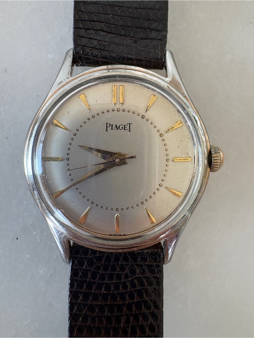 Piaget Silver Dial Watch with Gold Accents and Brown Leather Strap